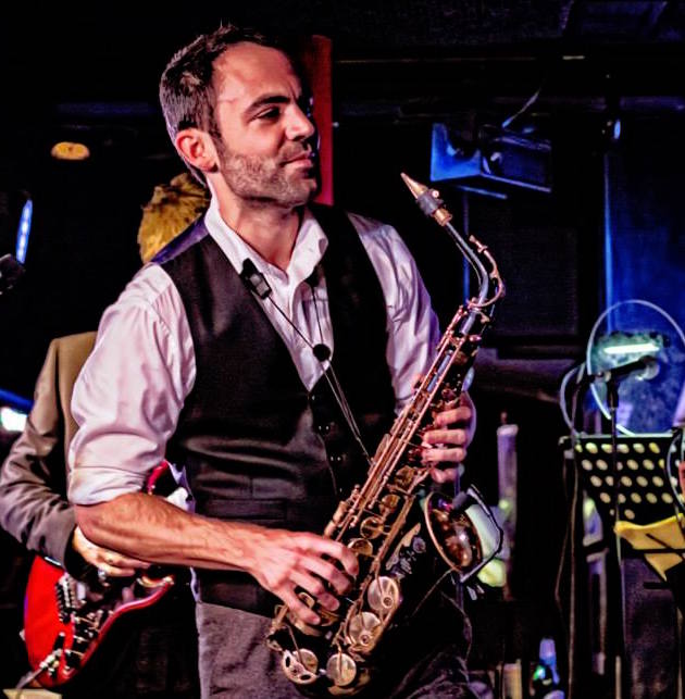 Ed Barker, founder of Division Bell, playing saxophone